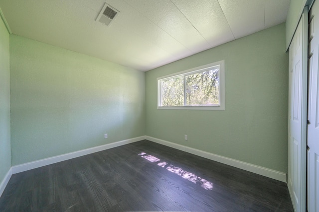 1430 Oakdale Ln, Redding, CA 96003 - unfurnished bedroom with dark wood-type flooring and baseboards