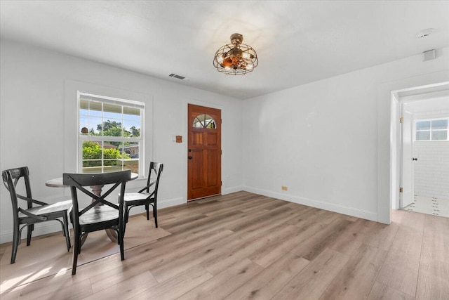 830 W St, Redding, CA 96001 - foyer entrance with light wood-style floors and baseboards