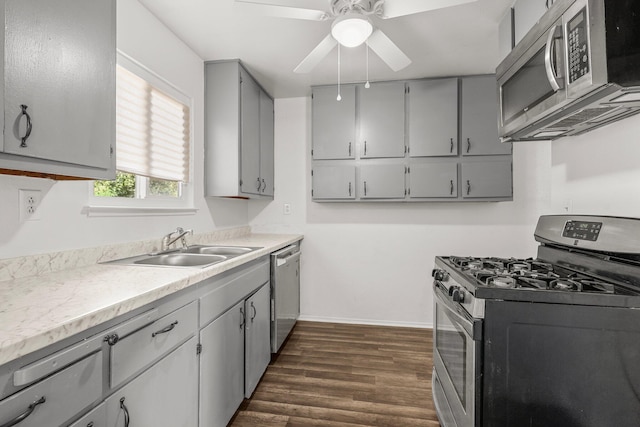 2092 Phobos Ct, Redding, CA 96002 - kitchen featuring stainless steel appliances, gray cabinets, dark wood-type flooring, a ceiling fan, and light countertops