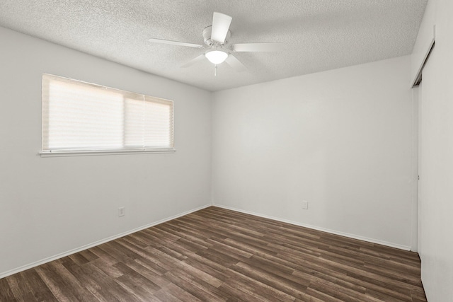 2092 Phobos Ct, Redding, CA 96002 - empty room featuring dark wood-type flooring, a ceiling fan, and a textured ceiling