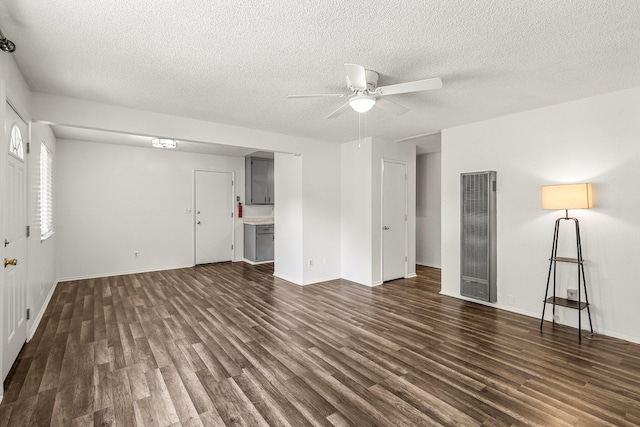 2092 Phobos Ct, Redding, CA 96002 - unfurnished living room featuring a heating unit, dark wood finished floors, a ceiling fan, and a textured ceiling