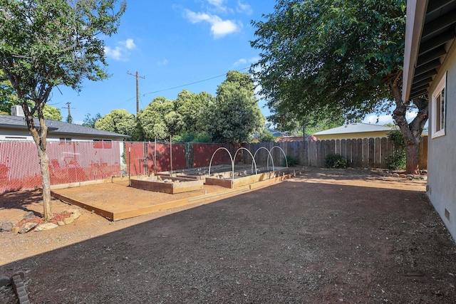 2092 Phobos Ct, Redding, CA 96002 - fenced backyard featuring a garden