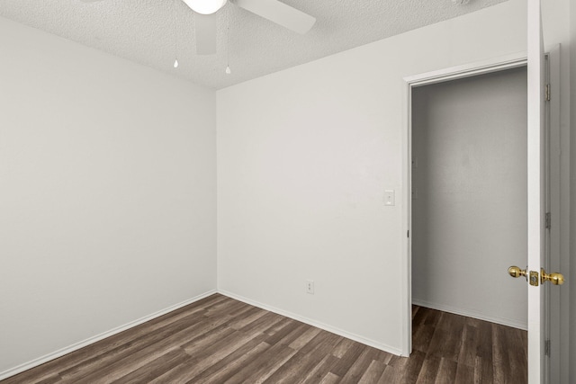 2092 Phobos Ct, Redding, CA 96002 - unfurnished room featuring dark wood-style floors, a ceiling fan, and a textured ceiling