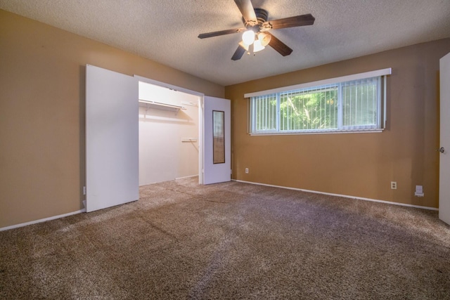 6781 Reflection St, Redding, CA 96001 - unfurnished bedroom with carpet floors, a textured ceiling, a ceiling fan, and a spacious closet