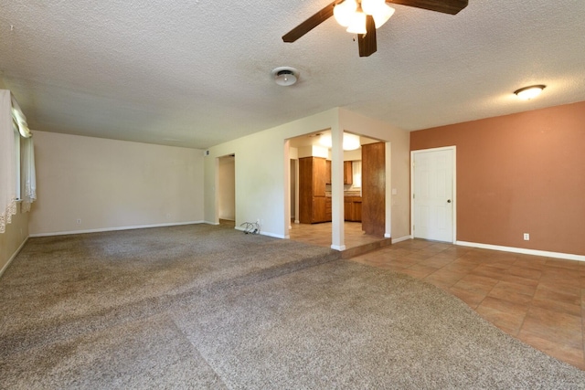 6781 Reflection St, Redding, CA 96001 - tiled empty room with a ceiling fan, a textured ceiling, and carpet