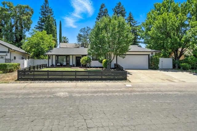 1683 Lakeside Dr, Redding, CA 96001 - view of front of property with a garage, a fenced front yard, driveway, and a gate