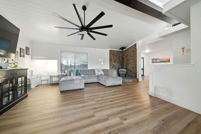 1683 Lakeside Dr, Redding, CA 96001 - living area featuring a wood stove, ceiling fan, and wood finished floors
