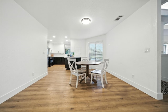 1683 Lakeside Dr, Redding, CA 96001 - dining space featuring light wood-style floors and recessed lighting