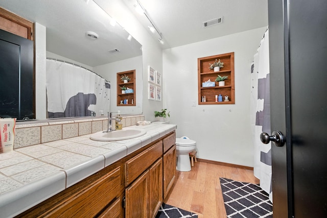 1683 Lakeside Dr, Redding, CA 96001 - full bathroom with wood finished floors and vanity