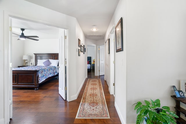 2834 Aspen Glow Ln, Redding, CA 96001 - corridor featuring dark wood-style flooring and baseboards
