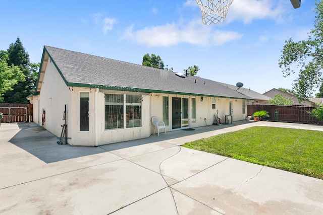 2834 Aspen Glow Ln, Redding, CA 96001 - rear view of property featuring roof with shingles, stucco siding, and a patio area
