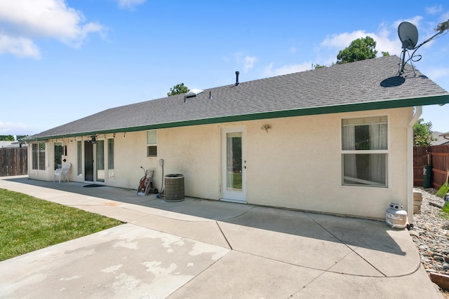 2834 Aspen Glow Ln, Redding, CA 96001 - back of house featuring a shingled roof, stucco siding, and a patio area