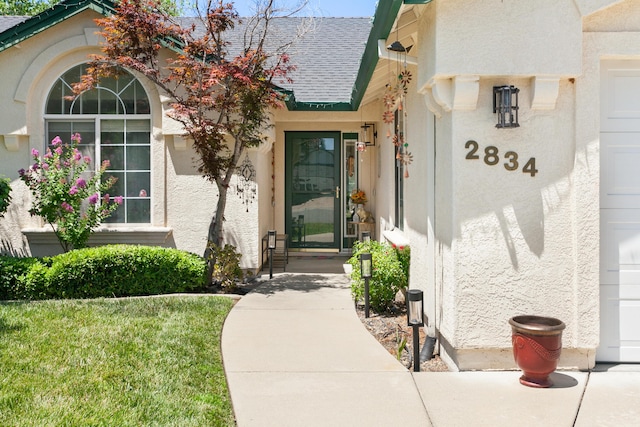 2834 Aspen Glow Ln, Redding, CA 96001 - property entrance featuring roof with shingles and stucco siding