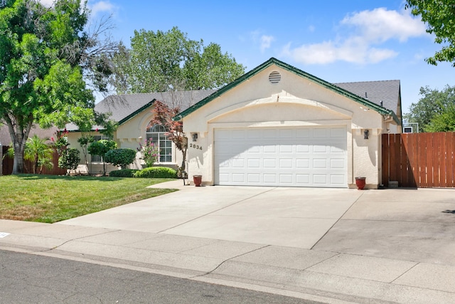 2834 Aspen Glow Ln, Redding, CA 96001 - single story home featuring a garage, concrete driveway, and stucco siding