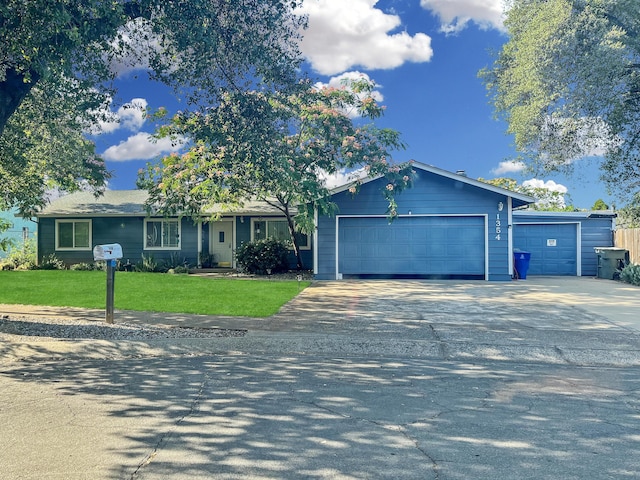 1354 Harpole Rd, Redding, CA 96002 - ranch-style house with an attached garage, a front yard, and driveway