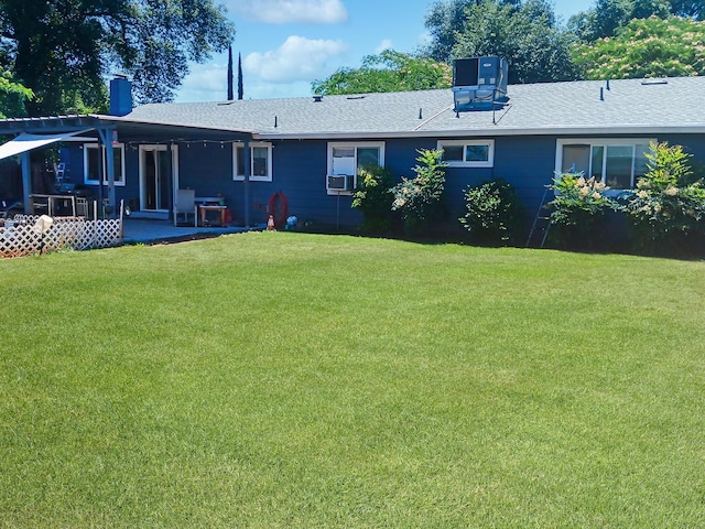 1354 Harpole Rd, Redding, CA 96002 - back of property featuring a lawn, a patio area, a chimney, and a shingled roof