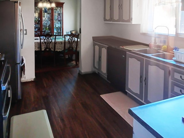 1354 Harpole Rd, Redding, CA 96002 - kitchen featuring dark wood-style flooring and freestanding refrigerator