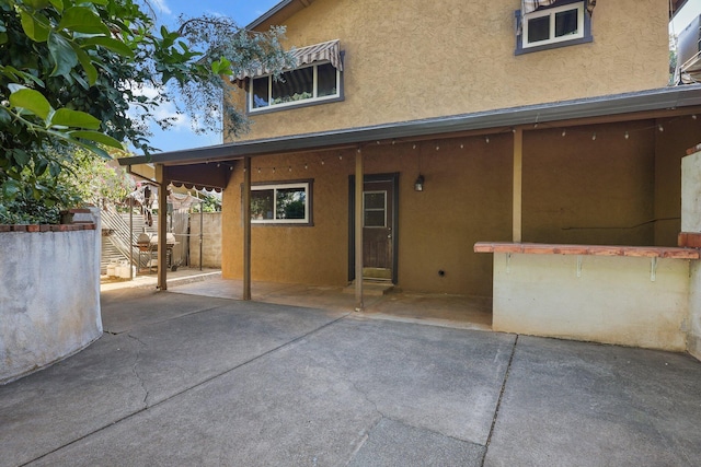 3428 Adams Ln, Redding, CA 96002 - back of property featuring stucco siding and a patio