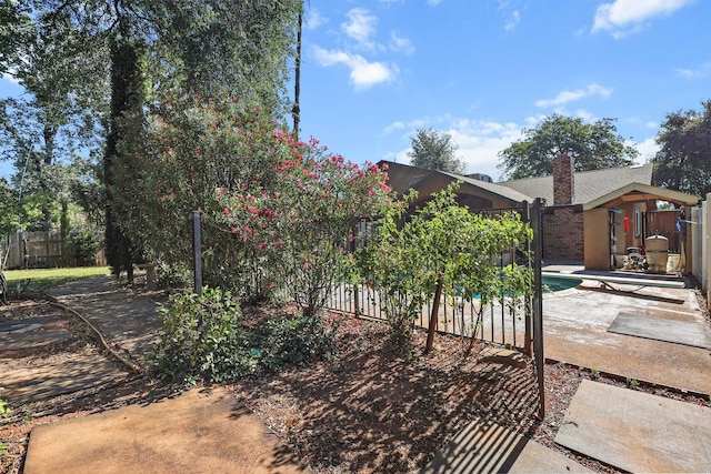 3428 Adams Ln, Redding, CA 96002 - view of front of property with a patio and a chimney