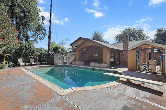 3428 Adams Ln, Redding, CA 96002 - view of swimming pool featuring a patio and a diving board