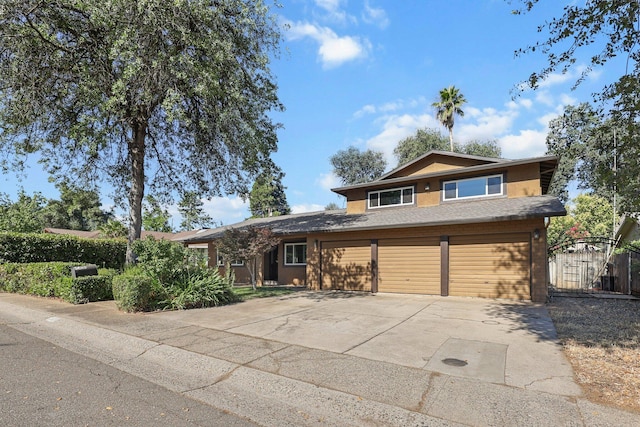 3428 Adams Ln, Redding, CA 96002 - view of front of house featuring concrete driveway, a garage, and stucco siding
