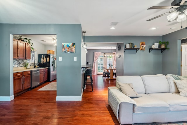 2623 Freebridge St, Redding, CA 96001 - living room featuring dark wood-style floors, ceiling fan, recessed lighting, and a chandelier