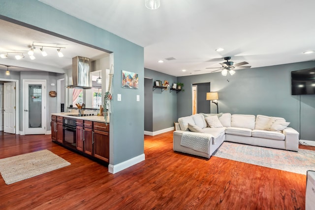 2623 Freebridge St, Redding, CA 96001 - living area featuring wood finished floors, a ceiling fan, and recessed lighting