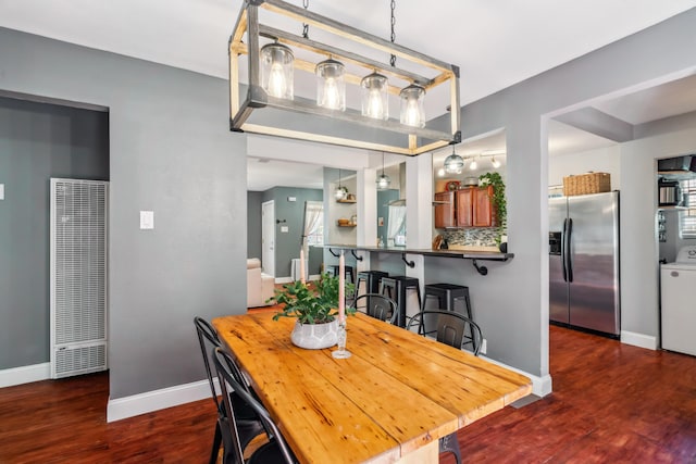 2623 Freebridge St, Redding, CA 96001 - dining area featuring a heating unit, wood finished floors, and washer / clothes dryer