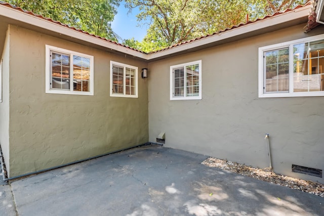 2623 Freebridge St, Redding, CA 96001 - view of side of property with a patio and stucco siding