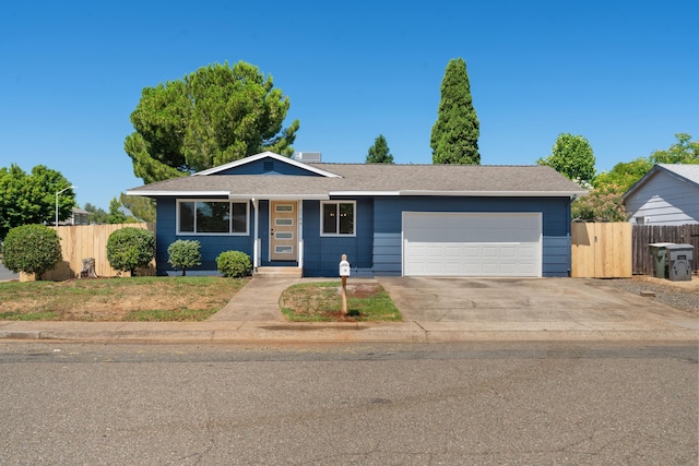 3704 Polaris Way, Redding, CA 96002 - single story home featuring a garage, concrete driveway, and roof with shingles