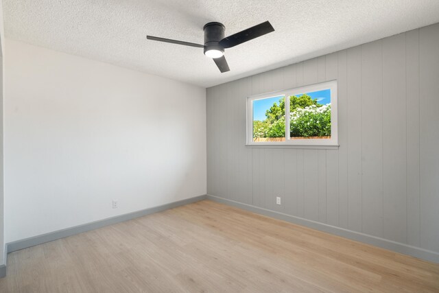 3704 Polaris Way, Redding, CA 96002 - unfurnished room with light wood-style floors, a ceiling fan, and a textured ceiling