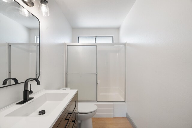 3704 Polaris Way, Redding, CA 96002 - full bath with vanity, enclosed tub / shower combo, and wood finished floors