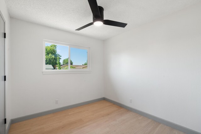 3704 Polaris Way, Redding, CA 96002 - unfurnished room featuring light wood finished floors, a ceiling fan, and a textured ceiling