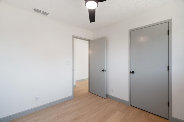 3704 Polaris Way, Redding, CA 96002 - unfurnished bedroom with light wood finished floors and ceiling fan