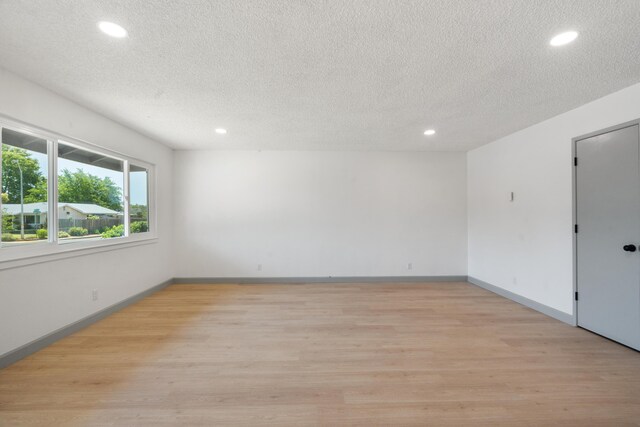 3704 Polaris Way, Redding, CA 96002 - empty room featuring recessed lighting, a textured ceiling, and light wood-style flooring