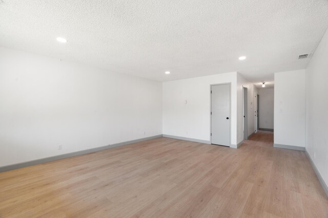 3704 Polaris Way, Redding, CA 96002 - empty room featuring recessed lighting, light wood-type flooring, and a textured ceiling