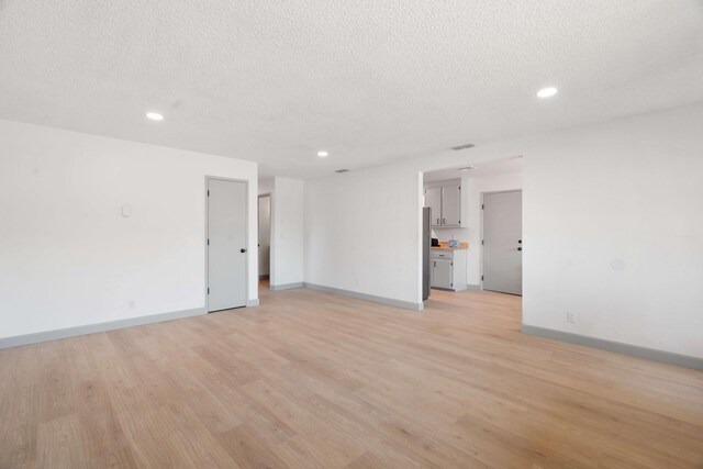 3704 Polaris Way, Redding, CA 96002 - unfurnished room with recessed lighting, light wood-type flooring, and a textured ceiling