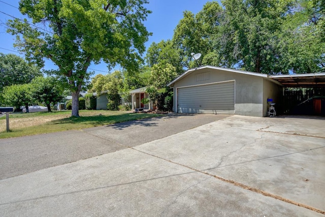 2308 Hawn Ave, Redding, CA 96002 - view of front facade with concrete driveway, a front yard, and a carport