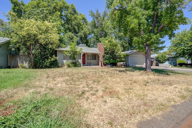 2308 Hawn Ave, Redding, CA 96002 - ranch-style house with a chimney and concrete driveway
