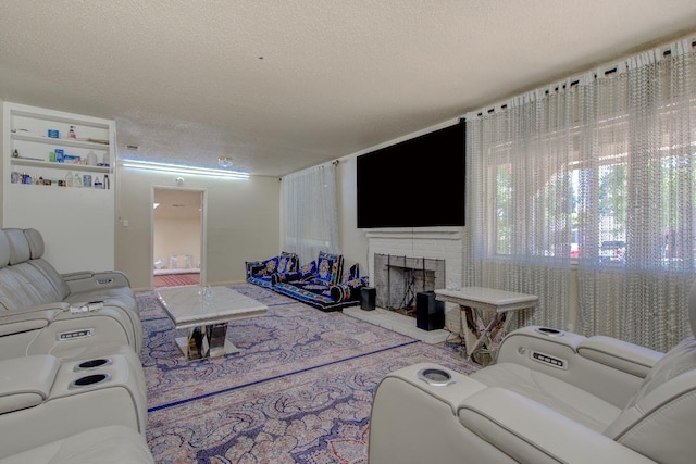 2308 Hawn Ave, Redding, CA 96002 - living room featuring a fireplace and a textured ceiling