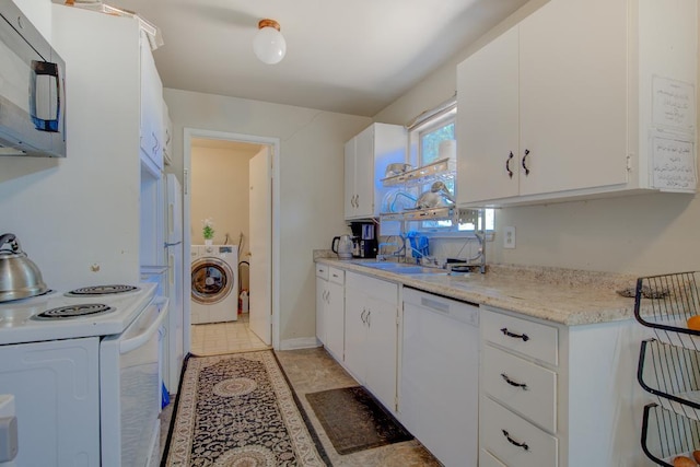 2308 Hawn Ave, Redding, CA 96002 - kitchen featuring white appliances, washer / clothes dryer, and white cabinets