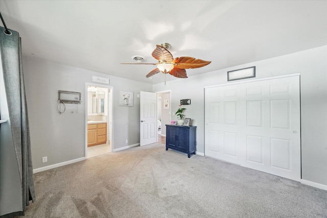2912 Squire Ave, Redding, CA 96002 - unfurnished bedroom with light colored carpet, a closet, ceiling fan, and ensuite bath