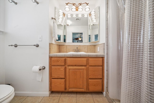 2912 Squire Ave, Redding, CA 96002 - bathroom with tile patterned flooring, vanity, a shower with curtain, and backsplash