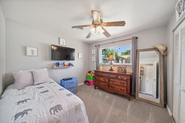 2912 Squire Ave, Redding, CA 96002 - carpeted bedroom with a closet and a ceiling fan