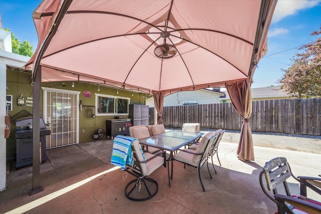 2912 Squire Ave, Redding, CA 96002 - view of patio with area for grilling, outdoor dining space, and a gazebo