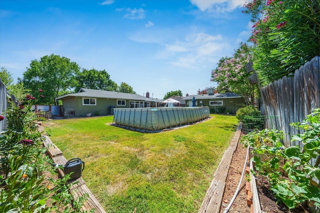 2912 Squire Ave, Redding, CA 96002 - fenced backyard with a vegetable garden