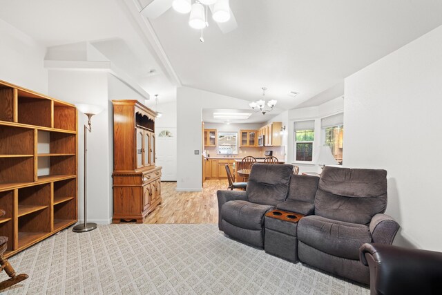 4592 Impression Way, Shasta Lake, CA 96019 - living area featuring a chandelier, light wood finished floors, lofted ceiling, and a ceiling fan