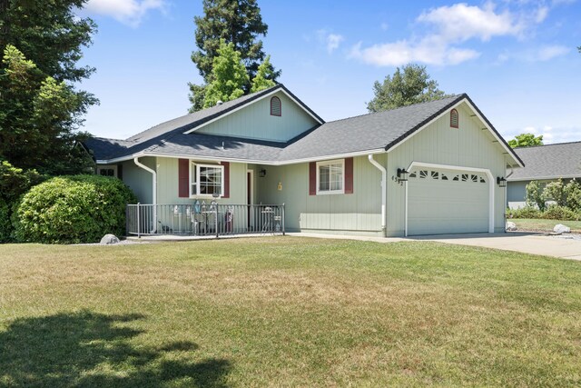 4592 Impression Way, Shasta Lake, CA 96019 - single story home with an attached garage, driveway, a front yard, a porch, and a shingled roof
