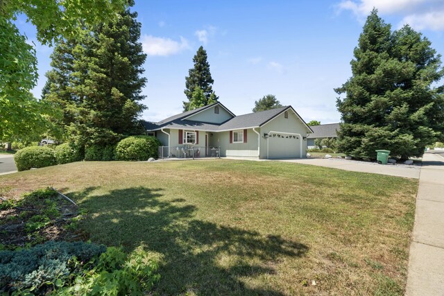 4592 Impression Way, Shasta Lake, CA 96019 - single story home featuring concrete driveway, a garage, and a front lawn