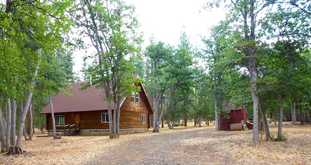 29119 Day Rd, Mcarthur, CA 96056 - view of side of home featuring dirt driveway and a shingled roof